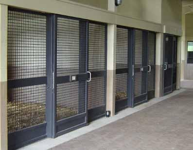 Built-in stall fronts are often constructed as part of the barn structure using brick,