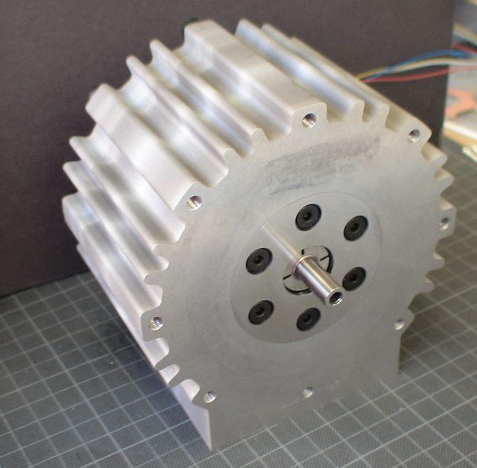 (a) Stator core made of.1-mm thick, 6.5-% silicone electromagnetic steel plates and single-turn stator windings. (a) Front view (load side) of prototype machine.