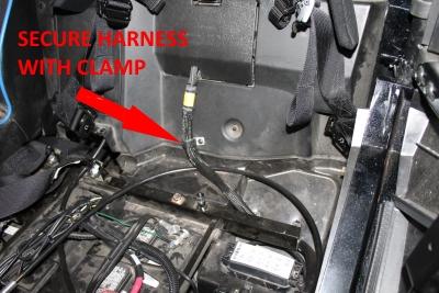 INSTALLATION 4. Replace the plastic access cover and route the AEM harness down towards the fuse box, below the seat bracket.