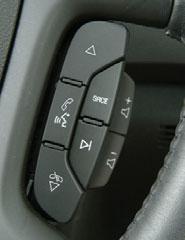 16 Getting to Know Your Acadia Audio Steering Wheel Controls The following audio controls are located on the steering wheel: + (Volume): Pull up on the + or button to increase or decrease the volume.