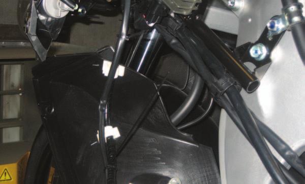 8 Use the supplied plastic ties to secure the PCV ignition harness to the fairing frame support.