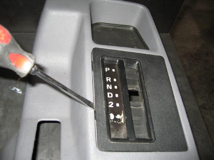 This can be done by using a small flat head screw driver to "pry off" the shift button end cap. To remove the handle, firmly grab and pull up until it releases from the shift lever. 2.