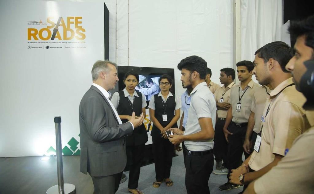 Teaching em young: Jochen Feese, Head of Accident Research, Pedestrian Protection and Sensor Functions, Daimler AMG, educates collegians on road safety.