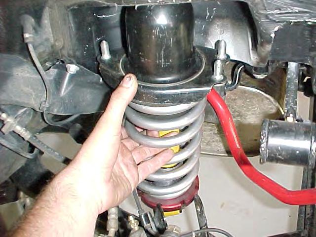 9) Install the strut assemblies into the car.