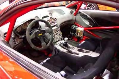 integrated custom roll cage, gauges from Auto Meter, Sparco seats and harnesses Countless hours of custom