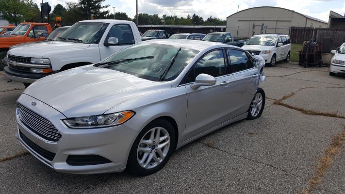 ITEM #14 PULLED FROM AUCTION ITEM #15 2016 Ford Fusion Silver