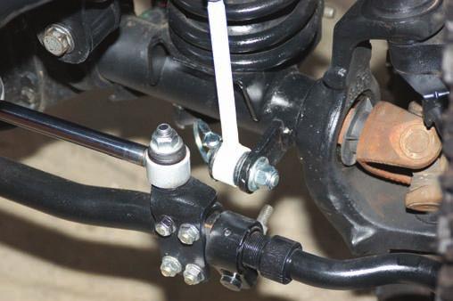 Install the supplied mounting pin as shown in Photo 17 and tighten using 19mm socket / wrench.