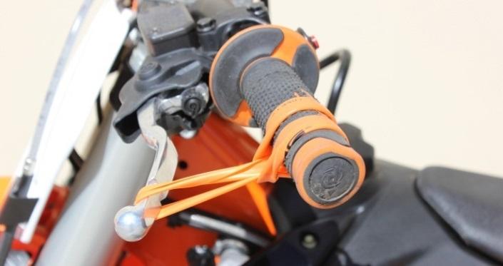 The clutch lever should move in about 1/8 (3mm) toward the handlebar as you rev the engine. Turn the Slave Cylinder adjuster screw clockwise 1 tick at a time until optimal clutch lever movement (i.e. Free Play Gain) is achieved.