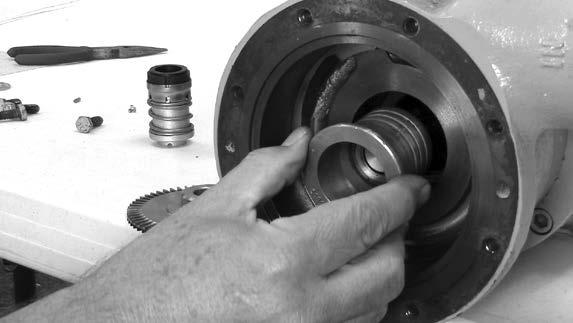 After the seal housing has been removed, locate and remove the shims behind the flange of the seal housing.