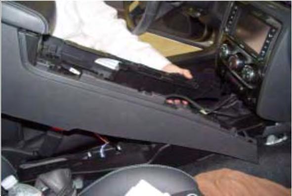 26. Install the rear A/C duct. 27. Reposition the center console into the vehicle. 28.