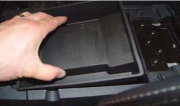 30. Replace the rubber tray in the center console storage box (if so equipped). 31.