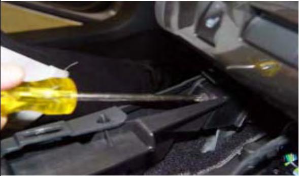 Reconnect the cup-holder lighting connection under the center console trim/cup-holder plate and any other wire harness
