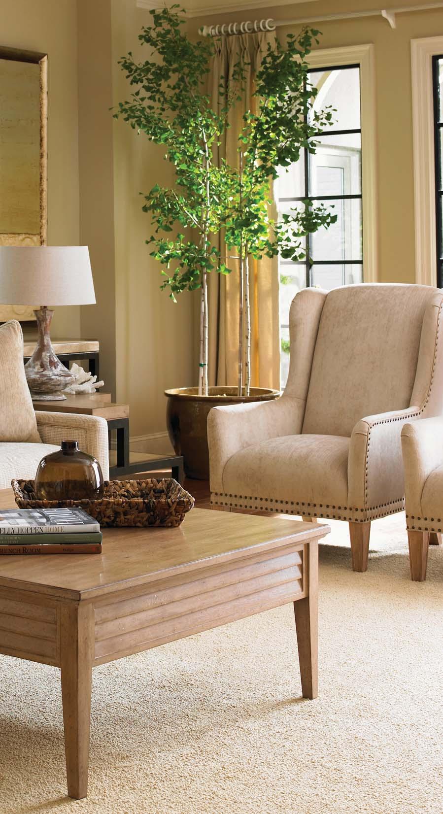 Living Room Hues of sand, parchment and driftwood create an elegant coastal-inspired setting that compliments the Cambria wood fi nish.