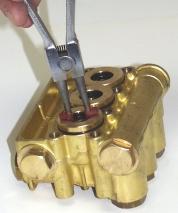 Move on to replace plungers if necessary. If plungers do not need replacing, reinstall the manifold head as described in "Reinstalling the Manifold" (Fig. F). Fig. G Fig.