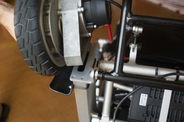 Once the two bolts are removed on the one side of the motor, as shown in Figure 36, remove the joystick from the arm rest, as shown in Figure 18 (on page 15), and turn the chair upside down to gain