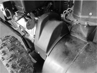 Service Adjustments Inspec on & Replacement of the Transmission Belt The transmission belt is located under the belt guard between the engine and impeller.