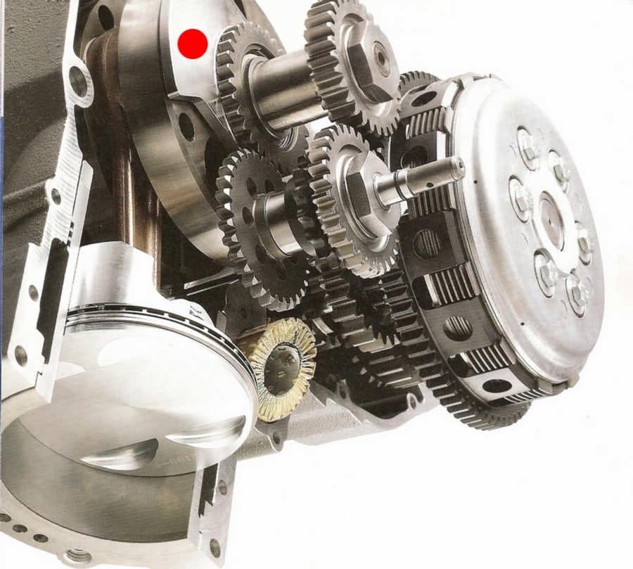 Husaberg engine. Instead of the usual balance shaft, this design uses a balance disc (marked by the red dot) concentric with the crankshaft.
