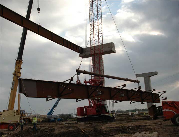 3.2.2 Girder 3 Lifting and Erection At 17:55, Girder 3 was initially lifted and moved to a second staging area and placed on large dunnage timbers.
