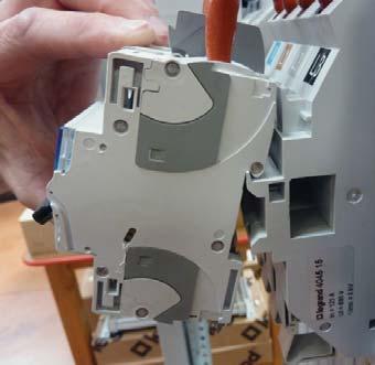 To prevent any risk of contact with live parts, the wires must be connected to the circuit breaker before the base is installed on the