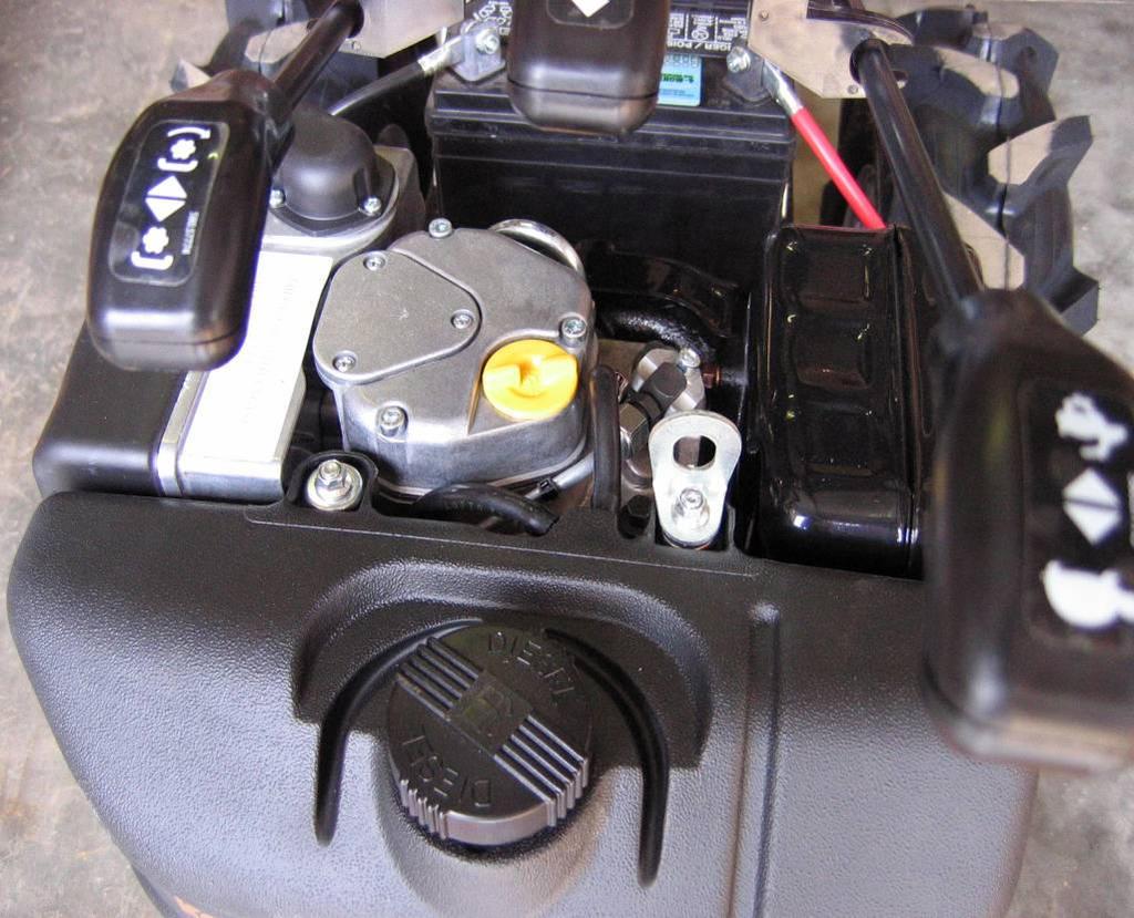 NOTE: Later-model BCS 853 tractors (May 2012 and later) equipped with Kohler diesel engines ALSO have an oil fill port (with yellow cap) on the side of the engine, very close to the oil dipstick