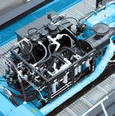 Ancillary hydraulics module supplies spreader, steering cylinders and brake system. High-power diesel-pump set.