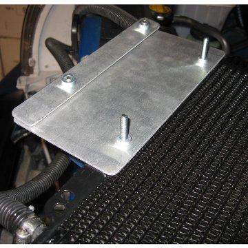 A. The oil cooler mounting bracket is fitted with special pressed in nutserts. Those must be on the rear side of the brackets. Attach the cooler to the mounting bracket using two M6x1.