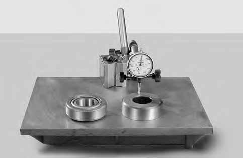 ASSEMBLY ASSEMBLY DG T6C T25C 13 T5 T2 4 T6A T25A FIGURE 13: Using a surface plate, reset a dial indicator "DG" and