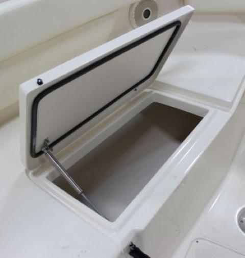 To port, there s open storage beneath a hinged hatch that opens on a gas strut.