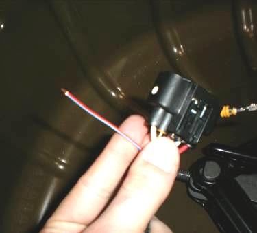 Take the relay and mount the relay to the rear trunk wall on the outboard side of the