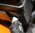Look to make sure all of the wires are routed through the ports in the side of the fuse panel (ports face the