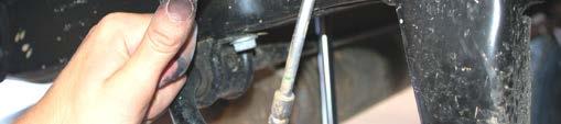 Using a 18mm socket and wrench remove the bottom sway