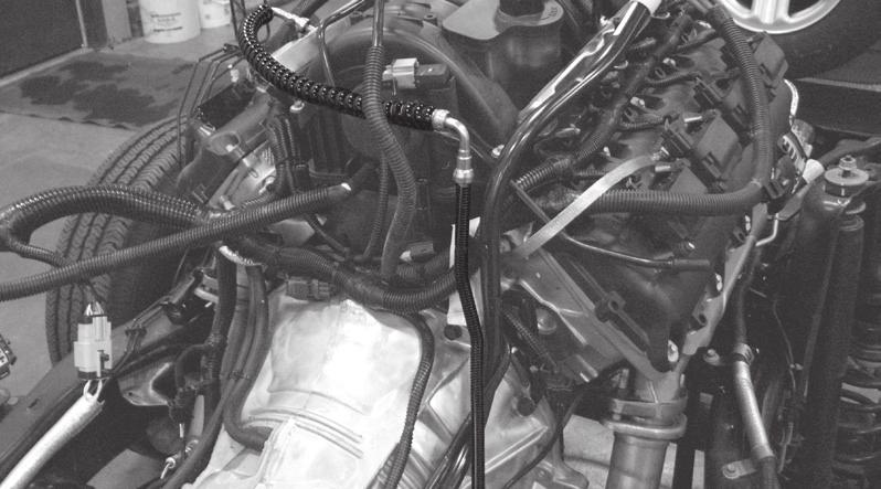 steel fuel line bracket from the V6 engine (fig. 2.) 3.