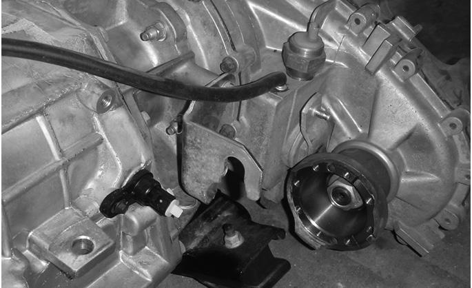 TIP 7: The stock JK transfer case cable bracket must be modified in order to clear the floorpan as shown in Figure 1. TIP 8: Fig. 1 The AEV Harness is the same for 5.7L, 6.1L, and 6.4L conversions.