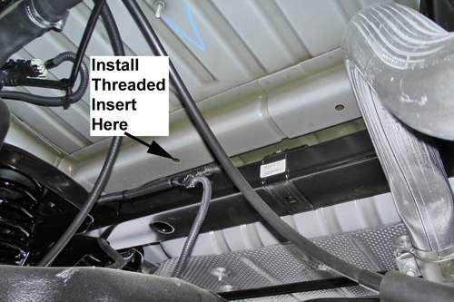 Under the JK 11. Locate the Factory Drilled Hole where the Threaded Insert will be installed. 12.