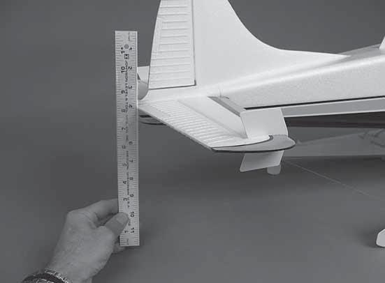 If more than a few clicks of trim are required, or if you cannot get both ailerons neutralized, a small screwdriver may be used to pop off one or both flap