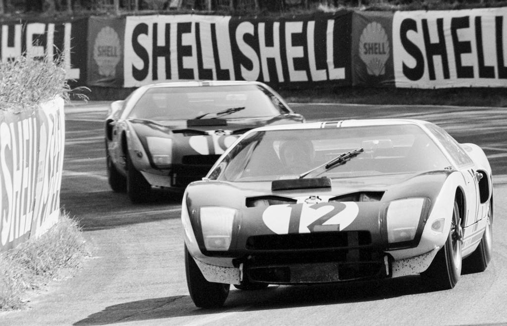 Part 1 Ford and Le Mans The Ford GT40 makes its debut at Le Mans in 1964: Richard Attwood (12) leads Bruce McLaren through the Esses.