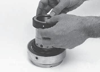 Slide the sleeve, with the rotary installed, downwards into the hub gland.