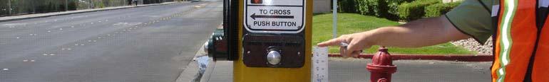 The RSA team noticed that some of the pedestrian push buttons are located above the 42 inch standard for push button height.
