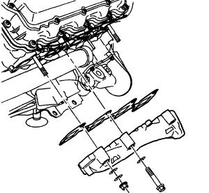 Remove the exhaust manifold by sliding it over the front and rear studs, out the bottom past the oil filter. 18. Replace the exhaust manifold gasket.