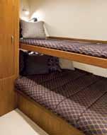 The starboard guest cabin has a pullout single berth, above a fixed