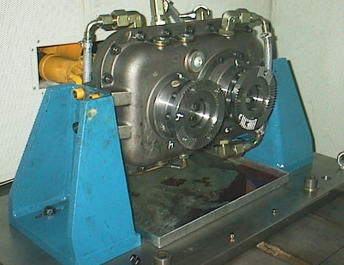 transmission housings. The same is true for the shafts and the bearings in the test gearbox.