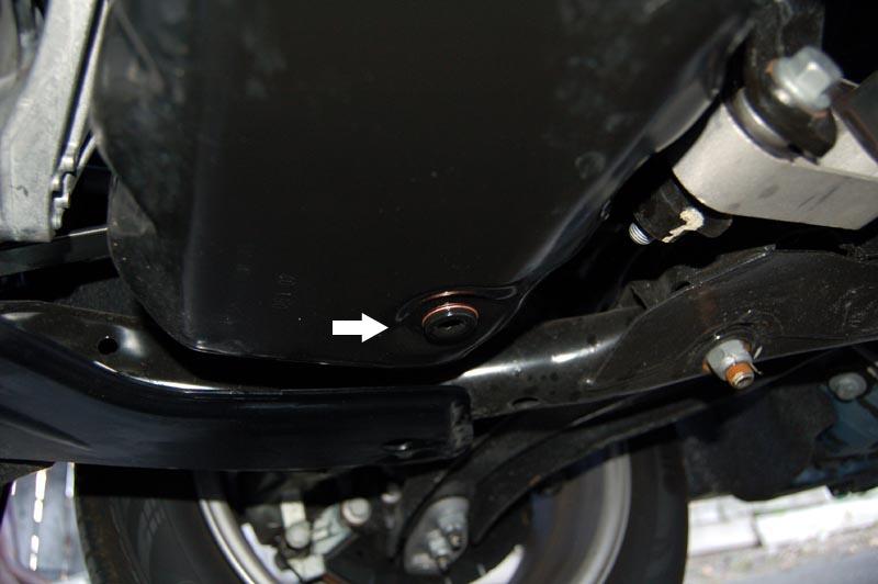6. On the bottom of the oil pan you will find the drain plug. You will need the #8 Allen wrench to take it out. 7. The copper crush washer should come off when you remove the drain plug.