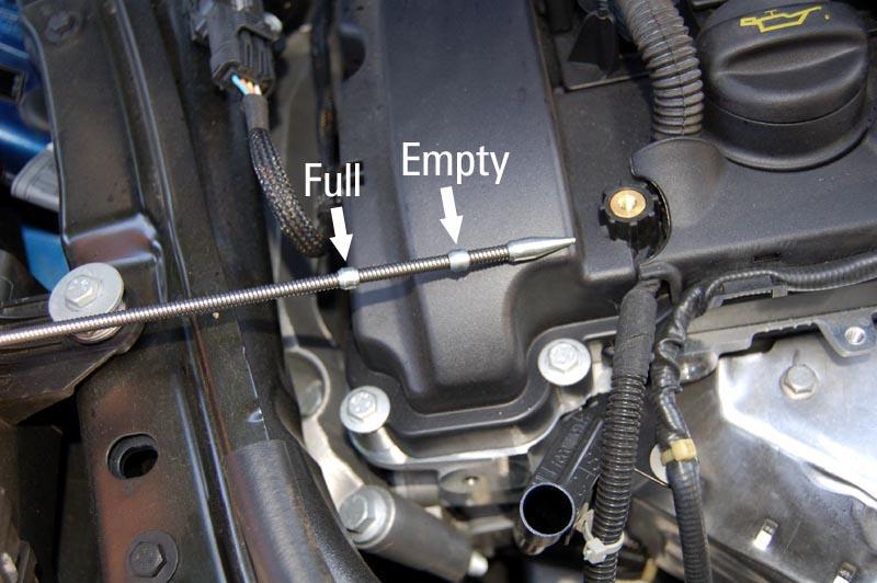 12. Here you see the very hard to read dipstick that MINI has once again given us. For the first pull you should just wipe off the dipstick and put it back in to get a correct reading.