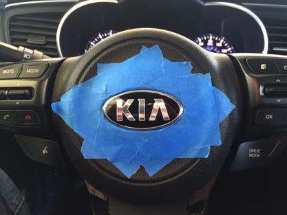 P.6 2013-2015 STEERING WHEEL KIA BADGE REMOVAL & K BADGE INSTALL THREE PRONGS THREE PRONGS Mask the area around the steering wheel badge and under the badge when possible.