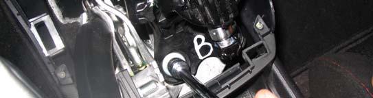 Using a 12 mm socket and ratchet with a 6 extension, remove the 3 bolts holding down the shift assembly.