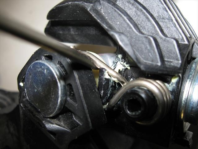 Remove the spring from the stock shifter assembly as pictured to the left