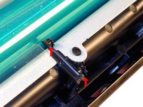 Check to insure that the waste toner pipe shutter slides smoothly, and that the small and large metal star wheels