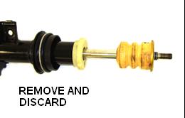4. REMOVE THE TWO (2) O-RINGS AND TWO (2) BACK-UP RINGS FROM THE TOP OF THE SHOCK SHAFT AND DISCARD.