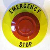 E-Stop Pushbutton. Figure 5-1: E-Stop Pushbutton A typical E-stop pushbutton is shown in Figure 5-1 To activate a pushbutton, push the entire red button in.