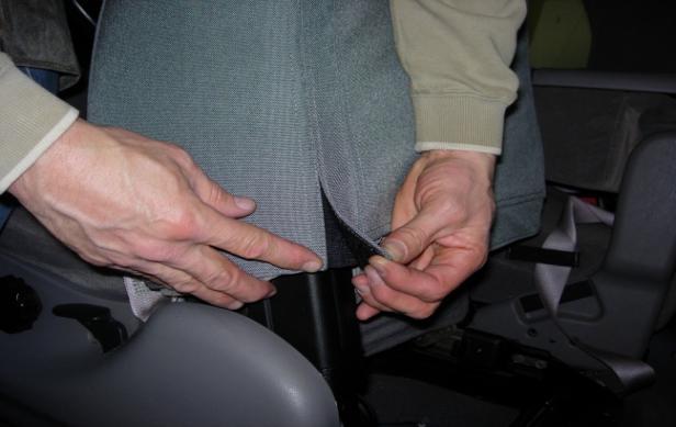 Driver and Passenger Tops: Mate the fasteners behind the plastic seatbelt box on top of the seat. Step 5.
